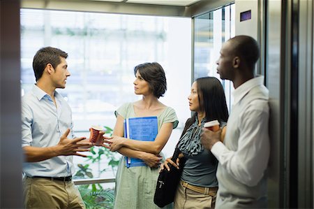 south africa and black and business - Business people riding glass elevator Foto de stock - Sin royalties Premium, Código: 649-06040669