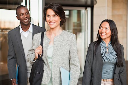 Business people walking outside building Stock Photo - Premium Royalty-Free, Code: 649-06040679