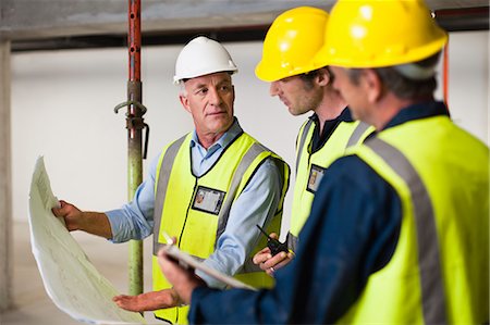 simsearch:649-07064416,k - Workers reading blueprints on site Stock Photo - Premium Royalty-Free, Code: 649-06040771