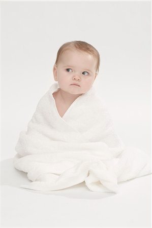 person with towel - Close up of baby girl wearing bathrobe Stock Photo - Premium Royalty-Free, Code: 649-06040988