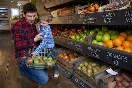 simsearch:6124-09004874,k - Father and son buying produce in store Stock Photo - Premium Royalty-Free, Code: 649-06041018