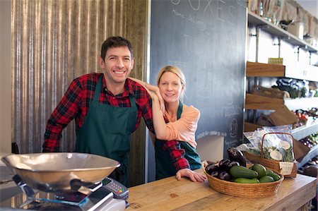 retail small business - Grocers smiling together in store Stock Photo - Premium Royalty-Free, Code: 649-06041035