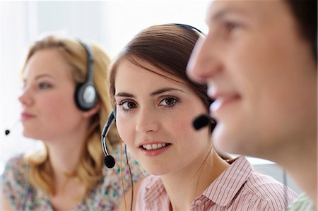 Business people working in headsets Stock Photo - Premium Royalty-Free, Code: 649-06041179