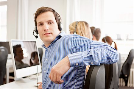 Business people working in headsets Foto de stock - Sin royalties Premium, Código: 649-06041209