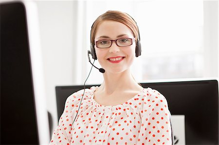 phone young woman computer - Businesswoman working in headset Stock Photo - Premium Royalty-Free, Code: 649-06041217