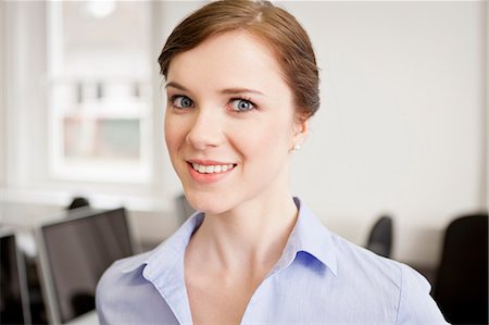 Businesswoman smiling in office Stock Photo - Premium Royalty-Free, Code: 649-06041218