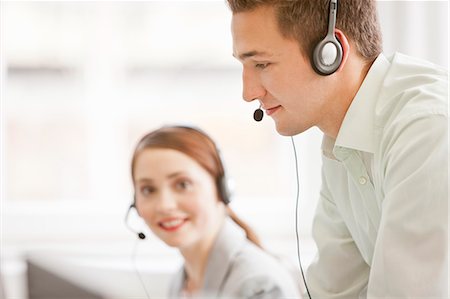 sale - Business people working in headsets Stock Photo - Premium Royalty-Free, Code: 649-06041212