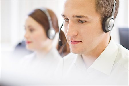 red de contactos - Business people working in headsets Foto de stock - Sin royalties Premium, Código: 649-06041247