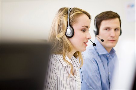 Business people working in headsets Stock Photo - Premium Royalty-Free, Code: 649-06041248