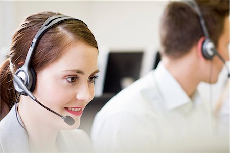 solution - Business people working in headsets Stock Photo - Premium Royalty-Free, Code: 649-06041249