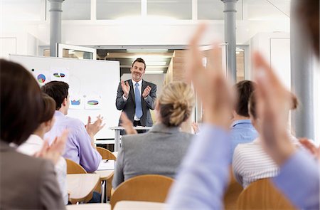 person office graph - Business people applauding at seminar Stock Photo - Premium Royalty-Free, Code: 649-06041274