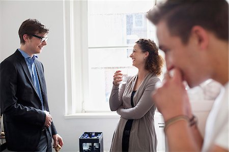 drinking water glass bottles - Business people talking in office Stock Photo - Premium Royalty-Free, Code: 649-06041276