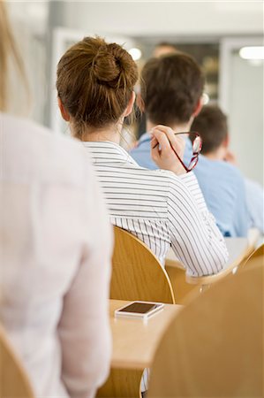 Business people sitting in seminar Foto de stock - Sin royalties Premium, Código: 649-06041286