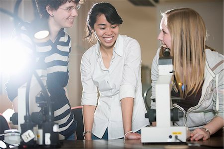 Students using microscope in lab Stock Photo - Premium Royalty-Free, Code: 649-06041387