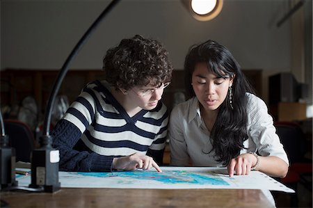 Students reading map in class Stock Photo - Premium Royalty-Free, Code: 649-06041393