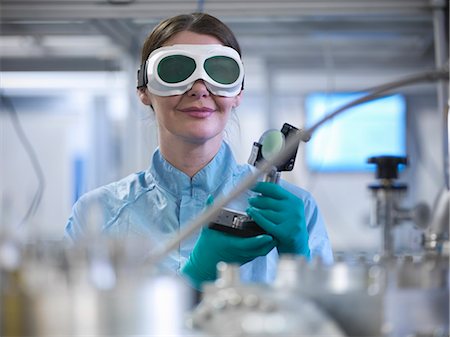 safety glasses - Scientist holding laser mirror in lab Stock Photo - Premium Royalty-Free, Code: 649-06041556