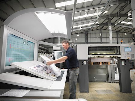 print - Worker examining pages in press Stock Photo - Premium Royalty-Free, Code: 649-06041616
