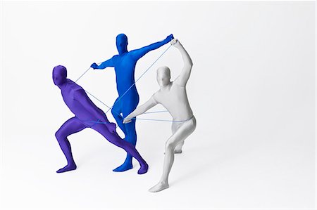 energetic collaboration - Men in bodysuits playing with string Stock Photo - Premium Royalty-Free, Code: 649-06041738