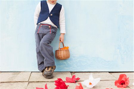 paper people - Boy holding basket of paper flowers Stock Photo - Premium Royalty-Free, Code: 649-06041855