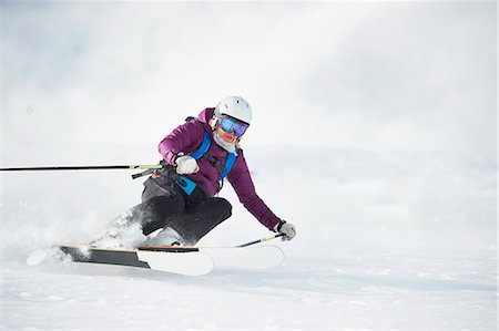 ski goggles mature not senior - Skier skiing on snowy slope Stock Photo - Premium Royalty-Free, Code: 649-06112503