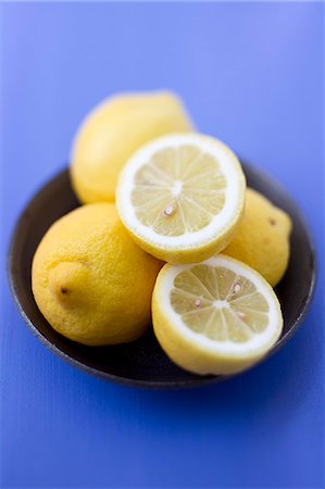 Close up of bowl of lemons Foto de stock - Sin royalties Premium, Código: 649-06112554