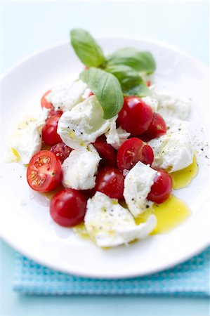 salad garnish - Close up of plate of tomatoes with mozzarella Stock Photo - Premium Royalty-Free, Code: 649-06112556
