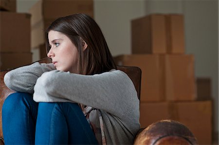 sad girl photos - Teenage girl in armchair in new home Stock Photo - Premium Royalty-Free, Code: 649-06112650