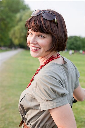 simsearch:649-06532695,k - Smiling woman standing in field Stock Photo - Premium Royalty-Free, Code: 649-06112672