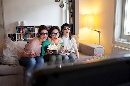 simsearch:649-06112975,k - Women watching 3D movie together Stock Photo - Premium Royalty-Free, Code: 649-06112952