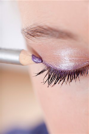 eyes closed - Close up of girl applying makeup Stock Photo - Premium Royalty-Free, Code: 649-06113073