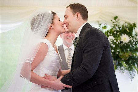 Newlywed couple kissing in wedding Stock Photo - Premium Royalty-Free, Code: 649-06113096