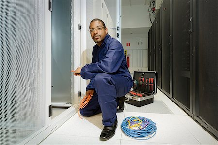 simsearch:6122-07706943,k - Technician working in server room Stock Photo - Premium Royalty-Free, Code: 649-06113268