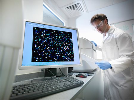 Scientists working with computer in lab Stock Photo - Premium Royalty-Free, Code: 649-06113279