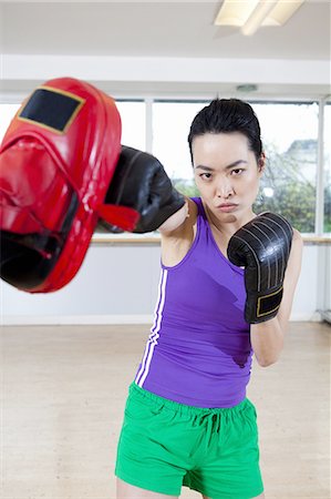 Boxer training with coach in gym Stock Photo - Premium Royalty-Free, Code: 649-06113448