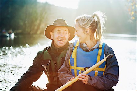 family vacation, lake - Couple sitting in canoe together Stock Photo - Premium Royalty-Free, Code: 649-06113522