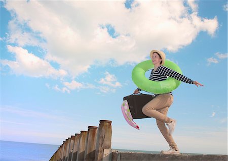 freedom and liberty concepts - Teenage girl with suitcase on dock Stock Photo - Premium Royalty-Free, Code: 649-06113747