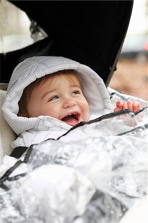 essex - Smiling boy riding in stroller outdoors Stock Photo - Premium Royalty-Free, Code: 649-06164439