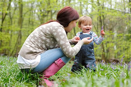 focus on foreground forest - Mother and son playing in forest Stock Photo - Premium Royalty-Free, Code: 649-06164440