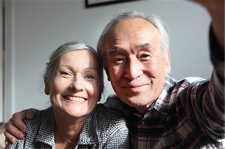 portrait asian older man - Couple taking pictures of themselves Stock Photo - Premium Royalty-Free, Code: 649-06164528