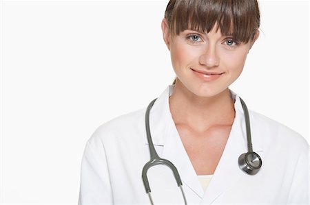 stethoscope cutout - Smiling doctor wearing stethoscope Stock Photo - Premium Royalty-Free, Code: 649-06164640