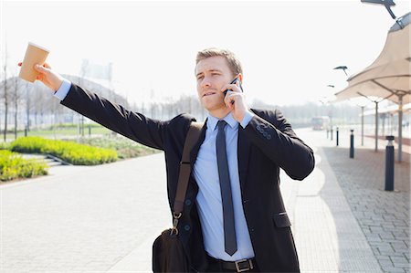 street coffee - Businessman hailing taxi on city street Stock Photo - Premium Royalty-Free, Code: 649-06164715