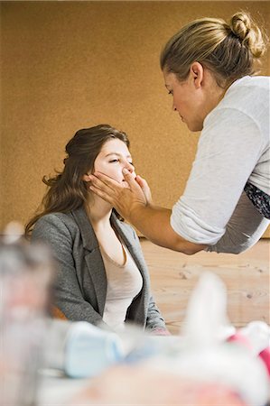 Make up artist working on client Stock Photo - Premium Royalty-Free, Code: 649-06164747