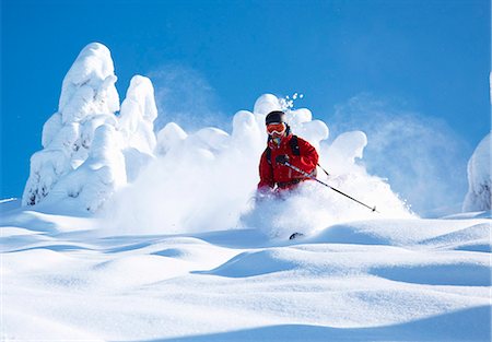 sports and skiing - Skier coasting on snowy slope Stock Photo - Premium Royalty-Free, Code: 649-06164814