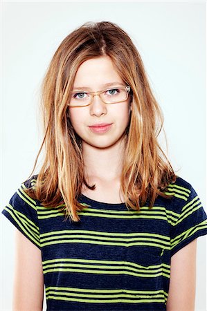 Smiling girl wearing glasses Stock Photo - Premium Royalty-Free, Code: 649-06164832