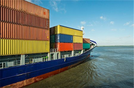 simsearch:6118-08827528,k - Container ship sailing into harbor Stock Photo - Premium Royalty-Free, Code: 649-06164890