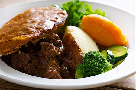 steak dinner - Plate of steak and kidney pie Stock Photo - Premium Royalty-Free, Code: 649-06165133