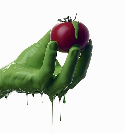 Green painted hand holding tomato Foto de stock - Sin royalties Premium, Código: 649-06165336