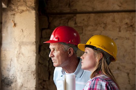 female checking her watch - Construction workers standing on site Stock Photo - Premium Royalty-Free, Code: 649-06304880