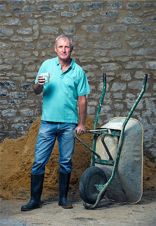 senior man in rubber boots - Man drinking tea in yard Stock Photo - Premium Royalty-Free, Code: 649-06304902