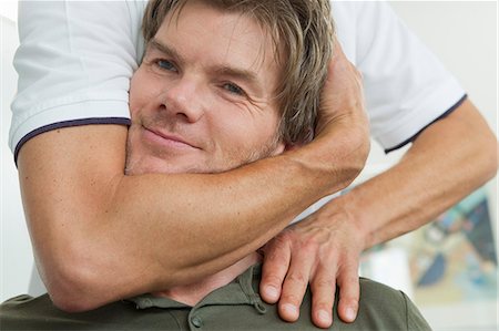 Close up of doctor examining patient Stock Photo - Premium Royalty-Free, Code: 649-06304913